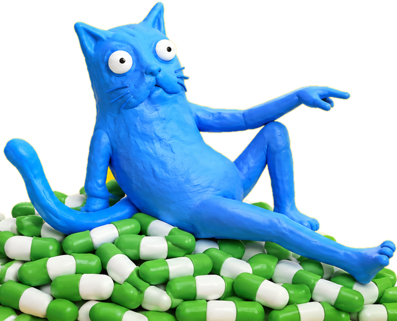 CATABU reclining on a heap of capsules, pointing at somebody out of frame